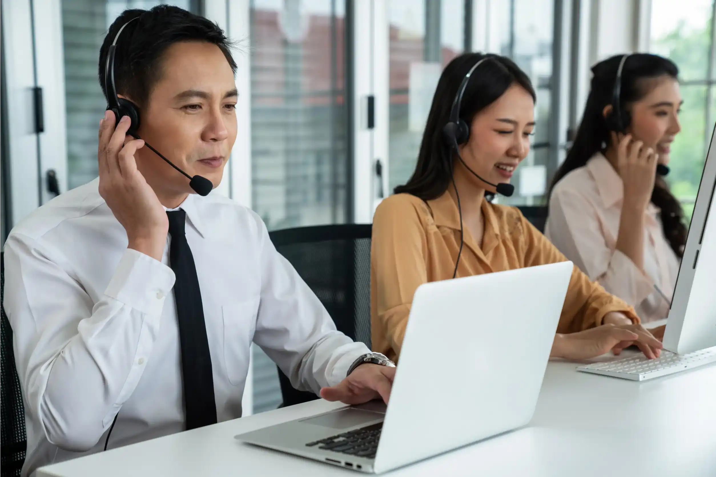 Business people wearing headset working actively in office